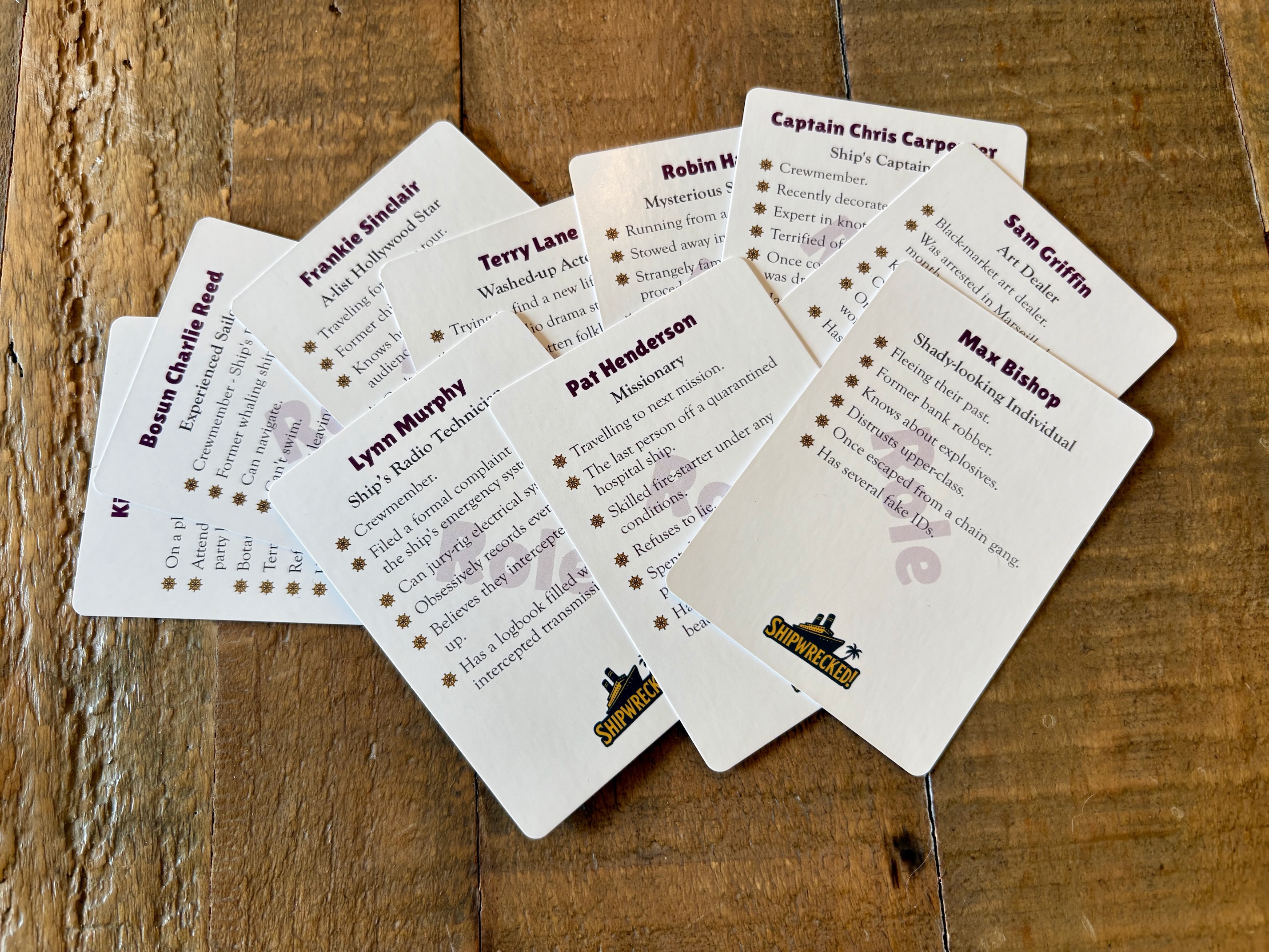Brimstone Role cards laid out on a wooden table